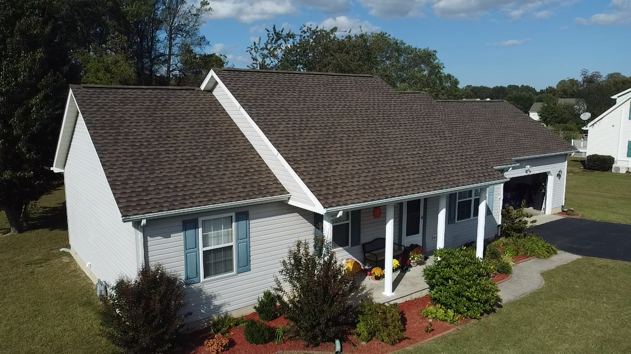 Dark grey roof on a white house