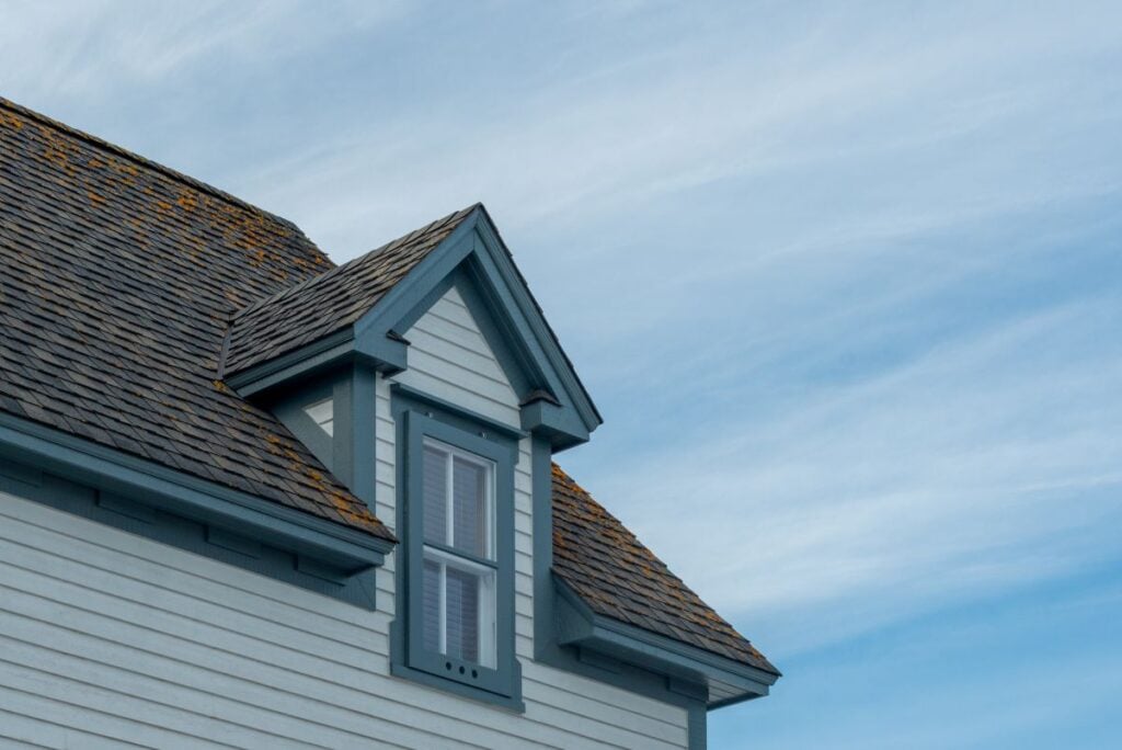 house and roof color combinations blue sky white siding brown shingles