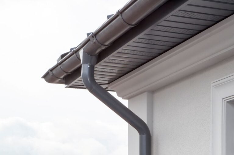 seamless gutters dark grey plasting water system